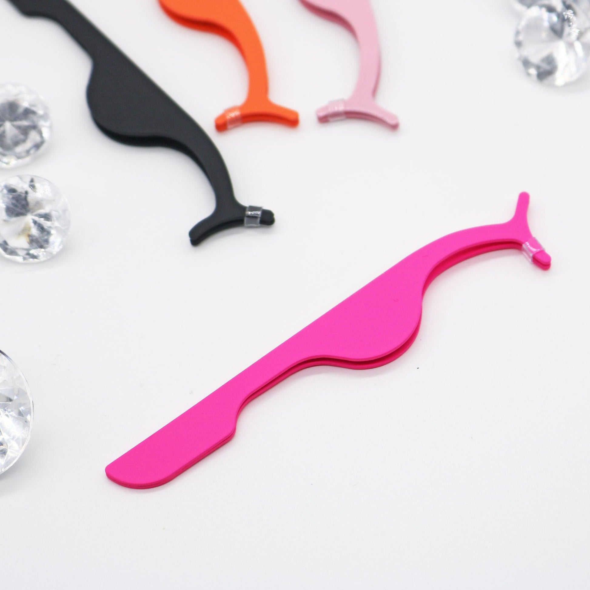 Eyelash tweezers pink, orange, black